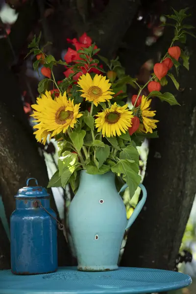 Sun flowers in a pot on a garden table