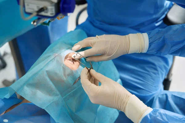 Woman Protective Suit Laying Operating Table Looking Having Operation Eye — Stock Photo, Image