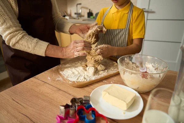 Young Boy Standing Table Kitchen Kneading Dough Table Grandmother Helping — Stock Photo, Image