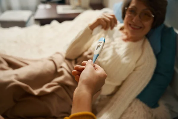 Boy Holding Thermometer Giving Grandmother Check Her Temperature Apartment — Stock Photo, Image