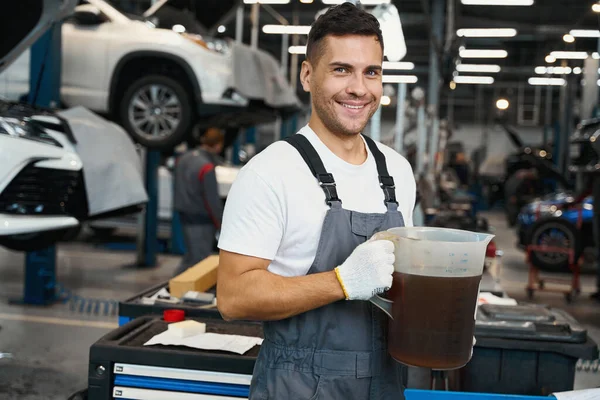 Portrait Male Special Suit Standing Garage Holding Jug Machine Oil — Stock Photo, Image