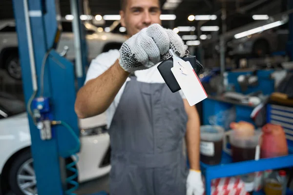 Portrait Mechanic Protective Clothes Gloves Standing Garage Holding Keys Looking — Stock Photo, Image