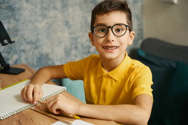 Portrait Boy Sitting Table Holding Pencil Doing School Homework Home — Stock Photo, Image