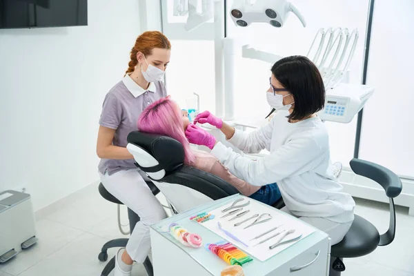 Woman Doctor Performs Dental Manipulations Special Tools Patient Comfortably Seated — Stock Photo, Image