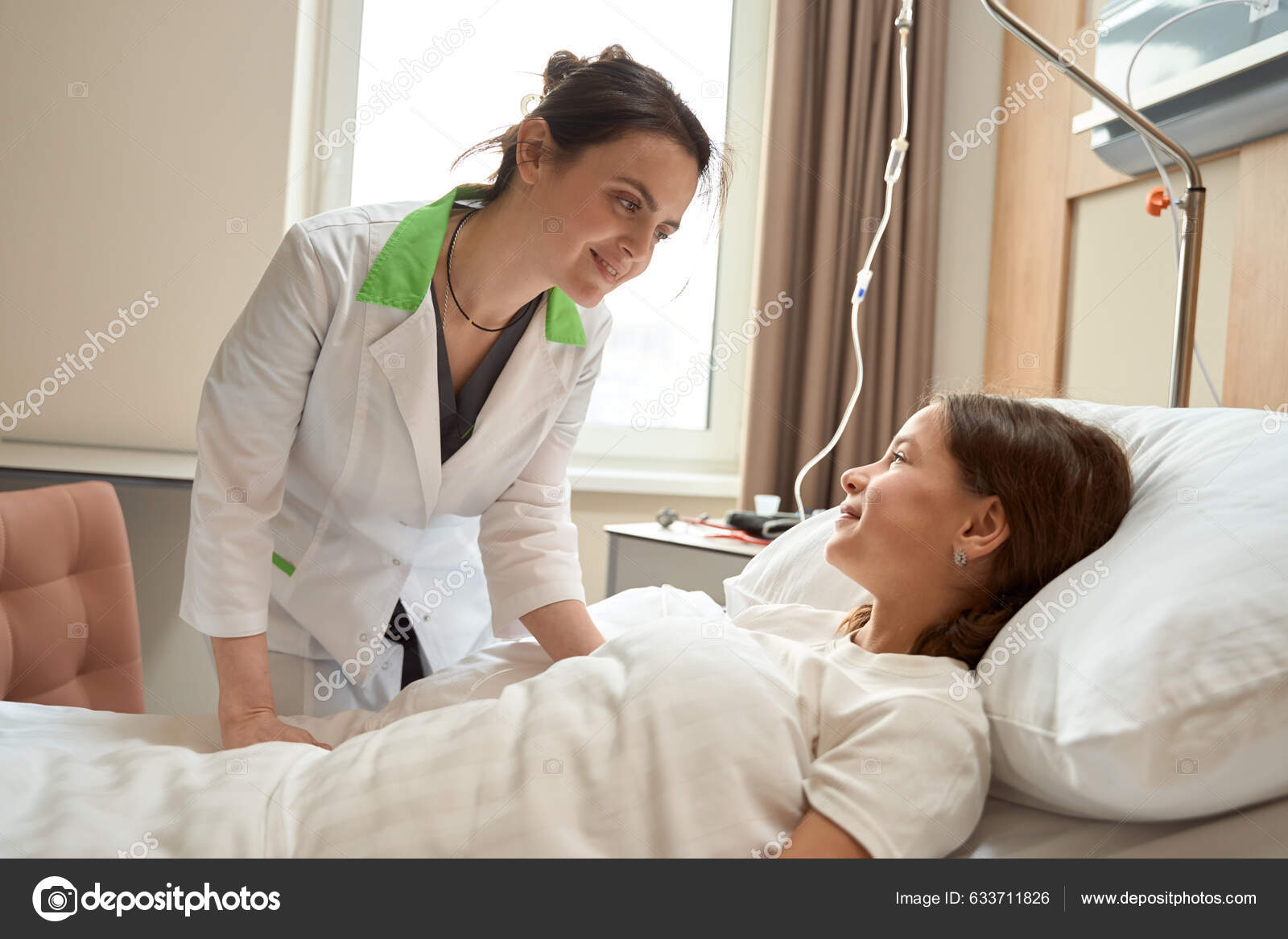 Kind Woman Doctor Bent Girl Child Lies Clean Hospital Bed — Stock Photo ©  svitlanahulko85.gmail.com #633711826