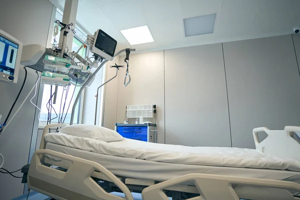 Close up photo of empty ward with bed and devices for support patient life in clinic