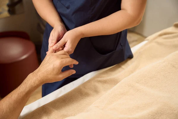 Physiotherapist Clinic Aesthetic Medicine Kneads Fingers Patient Man Lies Couch — Foto Stock
