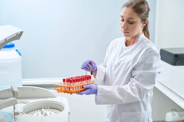 Female Doctor Holding Test Tube Examining Human Centrifuged Blood Sample — Stok fotoğraf
