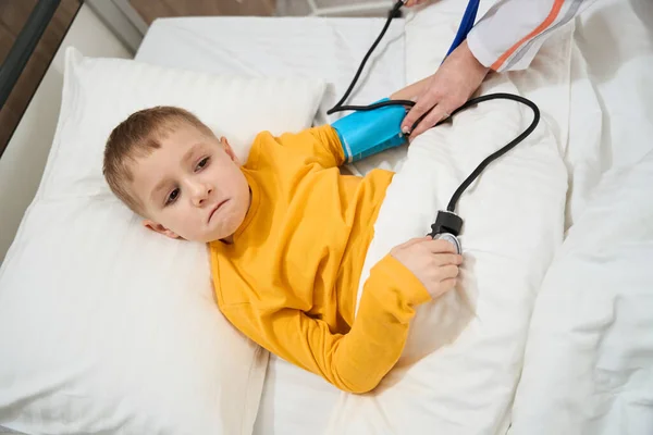 Close Portrait Stressed Little Boy Medical Bed Measuring Blood Pressure — Stock Photo, Image