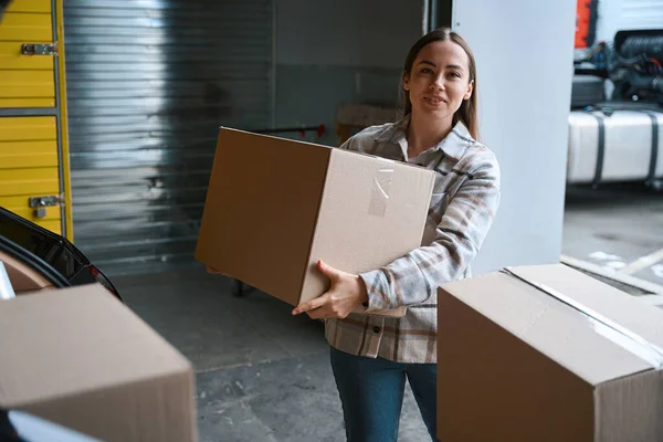 Smiling Young Female Person Standing Warehouse Holding Box Her Hands — Stock Photo, Image