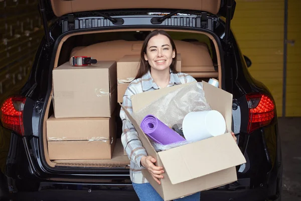 Satisfied Female Person Carrying Box Things Car Trunk Goods — Stock Photo, Image
