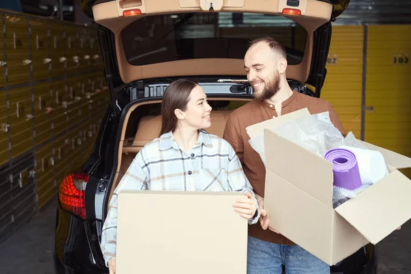 Satisfied Man Woman Standing Boxes Hands Car Storage Room — Stock Photo, Image