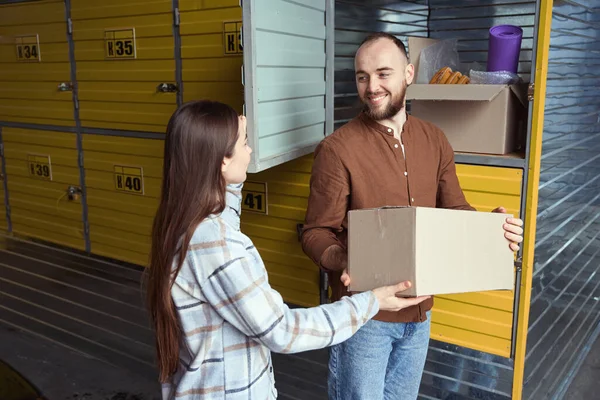 Two Contented People Holding Box Things Storage Locker Warehouse — Stock Photo, Image