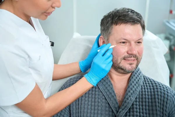 Specialist Cosmetologist Consultation Examines Face Middle Aged Patient Woman Holds — Stock Photo, Image