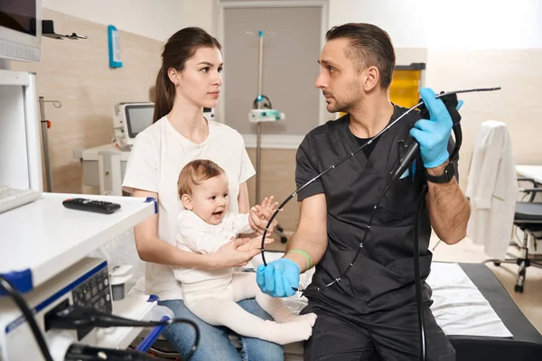 Young Endoscopist Holding Endoscope Insertion Tube Front Curious Baby Its — Stock Photo, Image