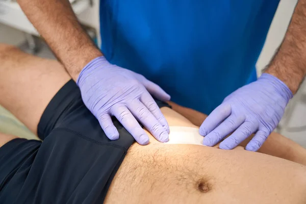 Male Phlebolist Applying Adhesive Plaster Patients Stomach Injections Mesh Vein — Stock Photo, Image