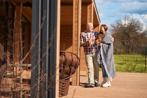 Loving Mature Man Embracing His Happy Female Companion Wooden Cottage — Stock Photo, Image