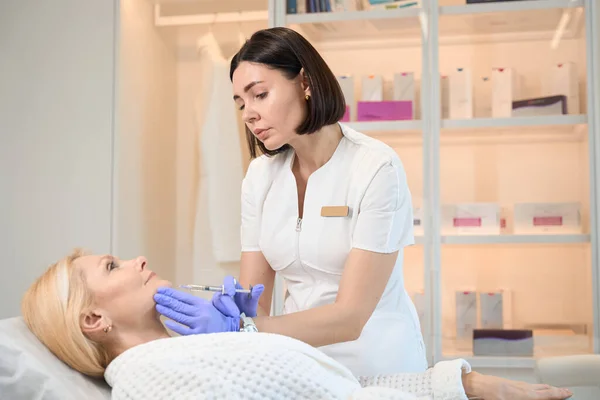 Cosmetologist Making Injection Mature Woman Chin Beautician Office — Stock Photo, Image