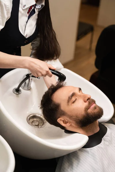 Male Enjoys Washing Hair Barbershop Female Master Washes Head Warm — Stock Photo, Image