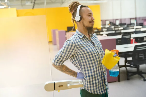 Young Janitor Suffers Back Pain Listens Music Headphones — Stock Photo, Image