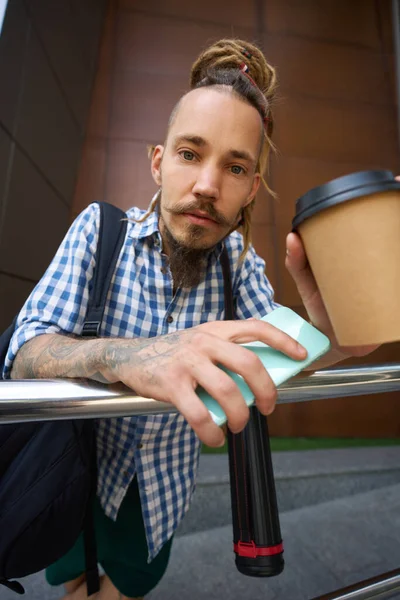 Man Dreadlocks Stands Modern Building Has Glass Coffee Phone — Stock Photo, Image