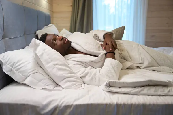 African American Guy Bathrobe Lies Cozy Bed Dawn Window — Stock Photo, Image