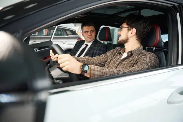 Young Man Discussing New Car Professional Salesman Sitting Front Seats — Stock Photo, Image