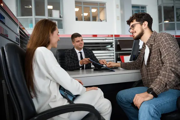 Happy Young Family Talking Dealer Customers Automobile Salon Signing Papers — Stock Photo, Image