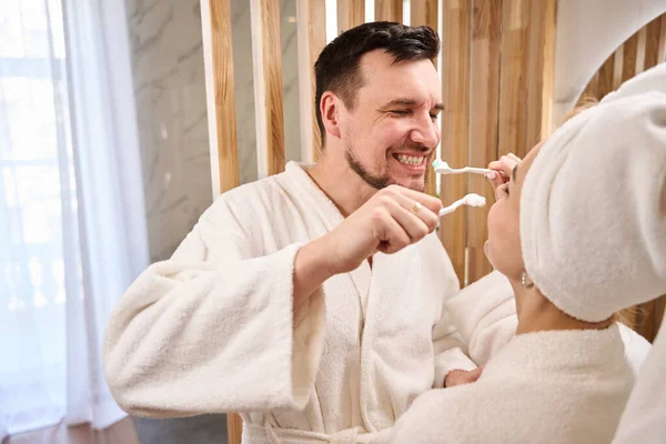 Cheerful Young Couple Doing Morning Routine Bathroom People Fluffy Bathrobes — Stock Photo, Image