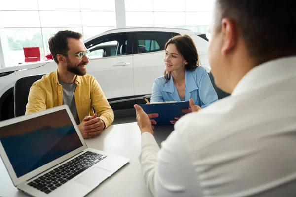 Buyers Finalize Deal Office Area Car Dealership Woman Signs Documents — Stock Photo, Image