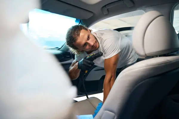 Young Man Cleans Front Seat Car Steam Generator Does Interior — Fotografia de Stock