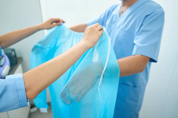 Partial Image Female Nurse Helping Male Doctor Put Medical Gown — Stock Photo, Image