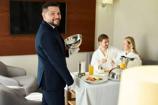 Smiling Waiter Served Breakfast Newlyweds Room Man Woman Enjoying Champagne — Stock Photo, Image