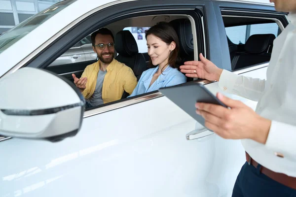 Manager Advises Spouses Test Drive New Car Couple Seated Car — Stock Photo, Image