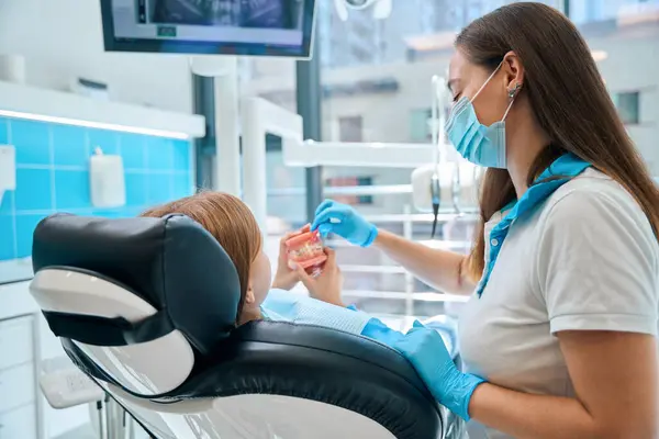 Teenage Girl Examines Fake Jaw Braces Dentist Teaches Child Oral — Stock Photo, Image