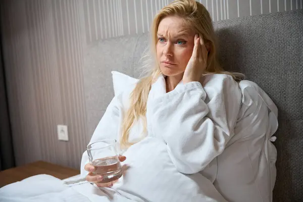 Sad Depressed Woman Glass Water Seated Bed Bedchamber Touching Her — Stock Photo, Image