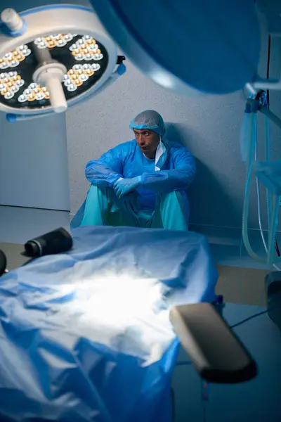 Tensed Surgeon Man Sitting Floor Operating Room Hospital — Stock Photo, Image