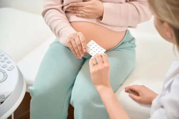 Caring Gynecologist Recommending Some Pills Pregnant Woman Who Complains Constipation — Stock Photo, Image