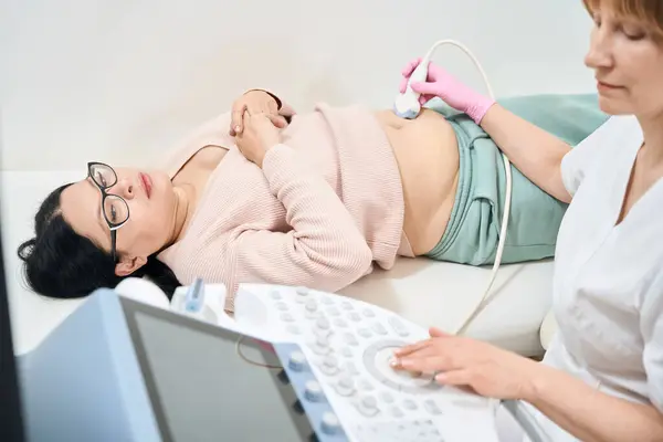 Concentrated Woman Sonographer Performing Ultrasound Abdominal Organs Adult Asian Patient — Stock Photo, Image