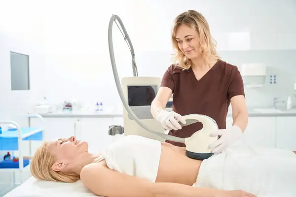 Smiling Doctor Conducting Body Contouring Cellulite Reduction Abdomen Zone Young — Stock Photo, Image