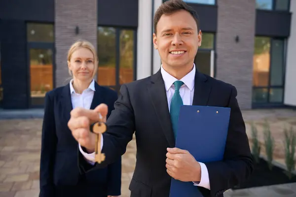 Smiling Male Real Estate Broker Holding Keys His Hand While — Stock Photo, Image