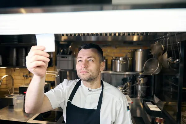 Professional Caucasian Male Chef Wearing Uniform Reading Note Blurred Restaurant — Stock Photo, Image