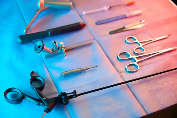 stock image Closeup of rectal biopsy forceps arranged on table next to anoscopes and stainless steel scissors