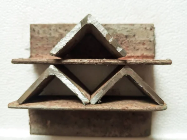 Angle iron arrangement triangle shape industrial back screen geometry