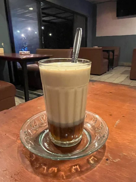 STMJ is a typical Indonesian health drink. Jamu drink made from a mixture of fresh milk, eggs, honey and ginger. STMJ is very beneficial for the body. A cup of glass ready to be stirred and enjoyed.