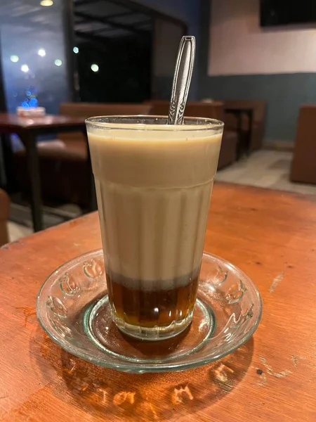 STMJ is a typical Indonesian health drink. Jamu drink made from a mixture of fresh milk, eggs, honey and ginger. STMJ is very beneficial for the body. A cup of glass ready to be stirred and enjoyed.