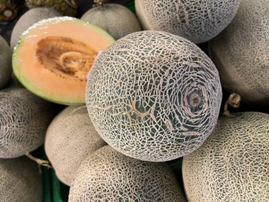 fresh fruit on display and ready for sale in the shop. Yields from fruit farmers. apples, melons, grapes, watermelon, avocados, guavas, grape. fresh fruit background ready to be used as design mockup.