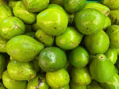 fresh fruit on display and ready for sale in the shop. Yields from fruit farmers. apples, melons, grapes, watermelon, avocados, guavas, grape. fresh fruit background ready to be used as design mockup.