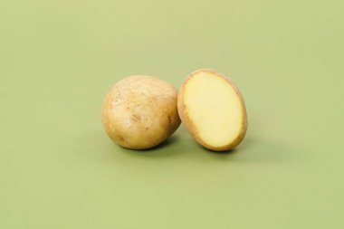 Washed potatoes, organic potato isolated on white background. Young potatoes. Peel potatoes.Harvesting collection. organic, freshly dug potatoes. Vegan. Vegetables.Potato slices.