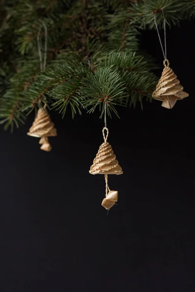 Bells on the Christmas tree. Christmas decor. Straw bells decorations. Straw products. Shallow depth of field (DOF)